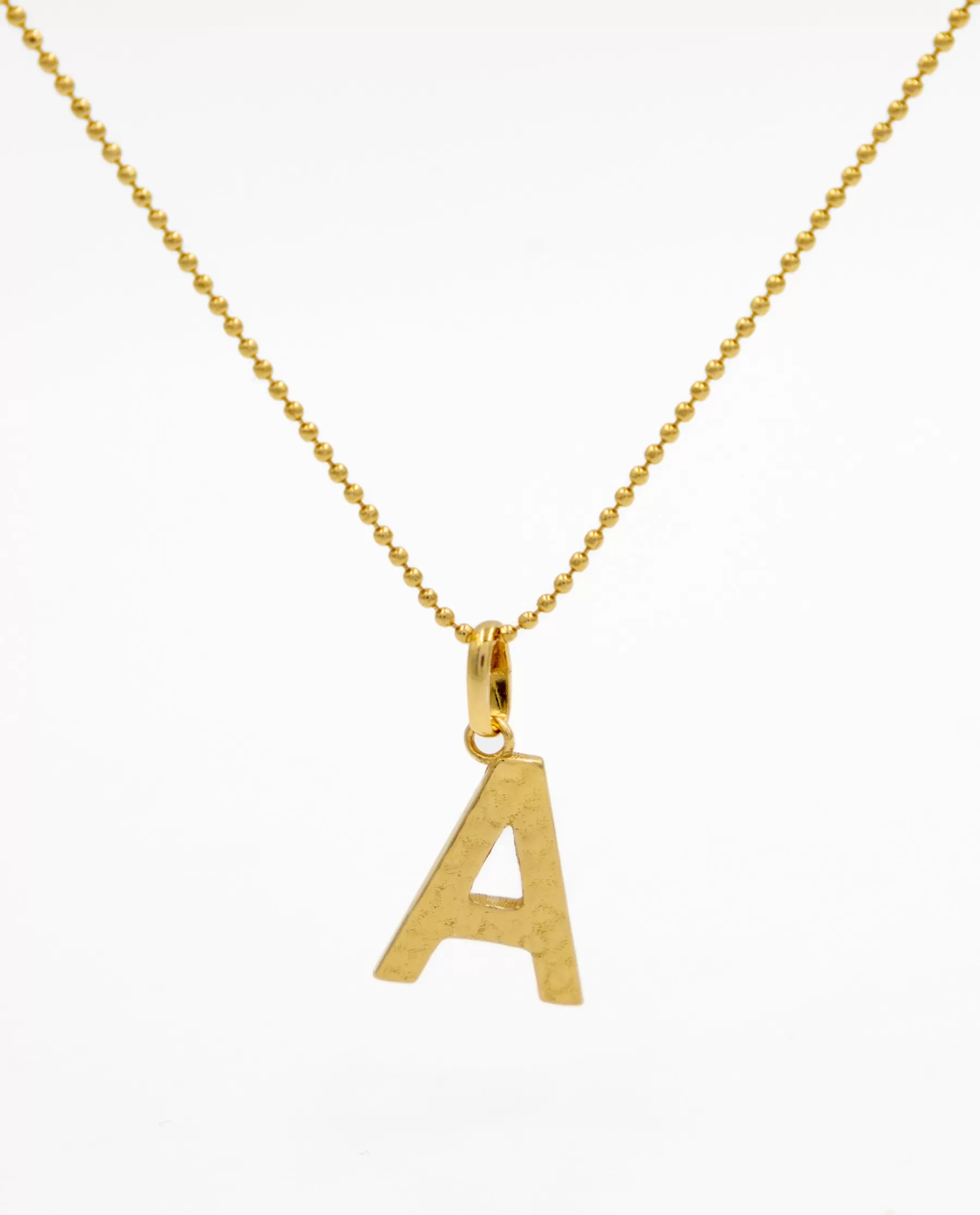 THE-ARE COLLAR LETRA AMULET · BAÑO ORO* Collares